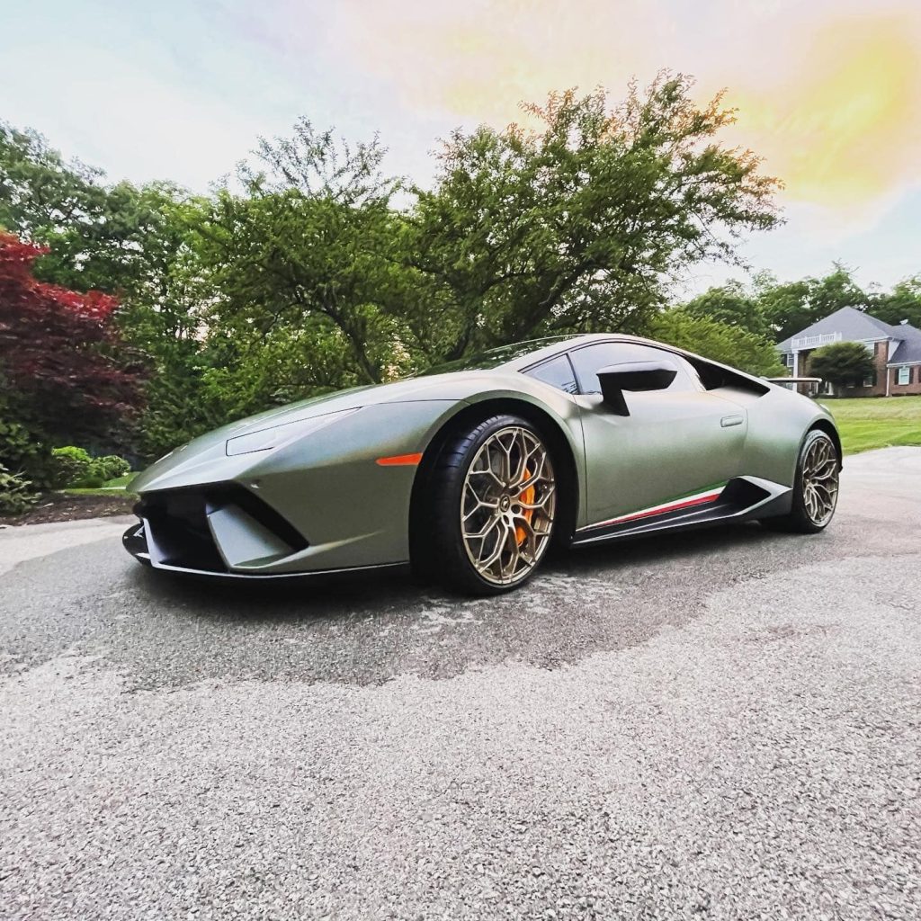 Olive green Lamborghini Huracán parked on a residential driveway following a premium mobile exterior detail near Baltimore, Maryland.